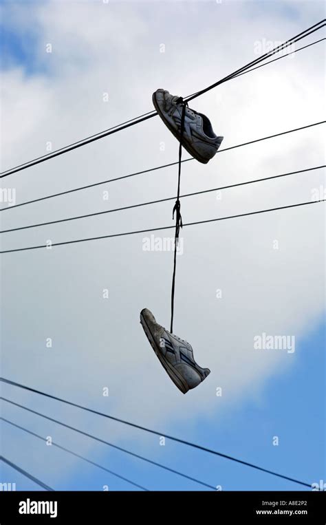 shoe hanging from phone wire.